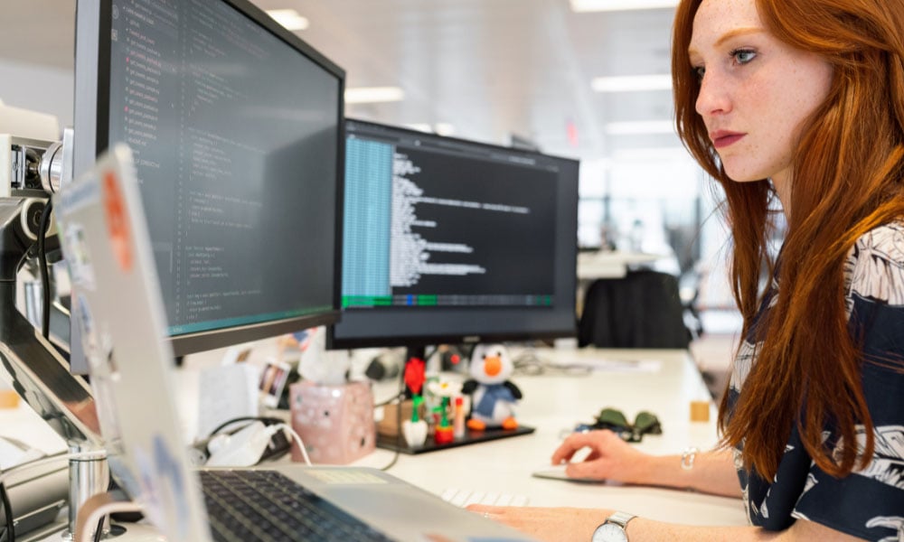 woman coding on computer